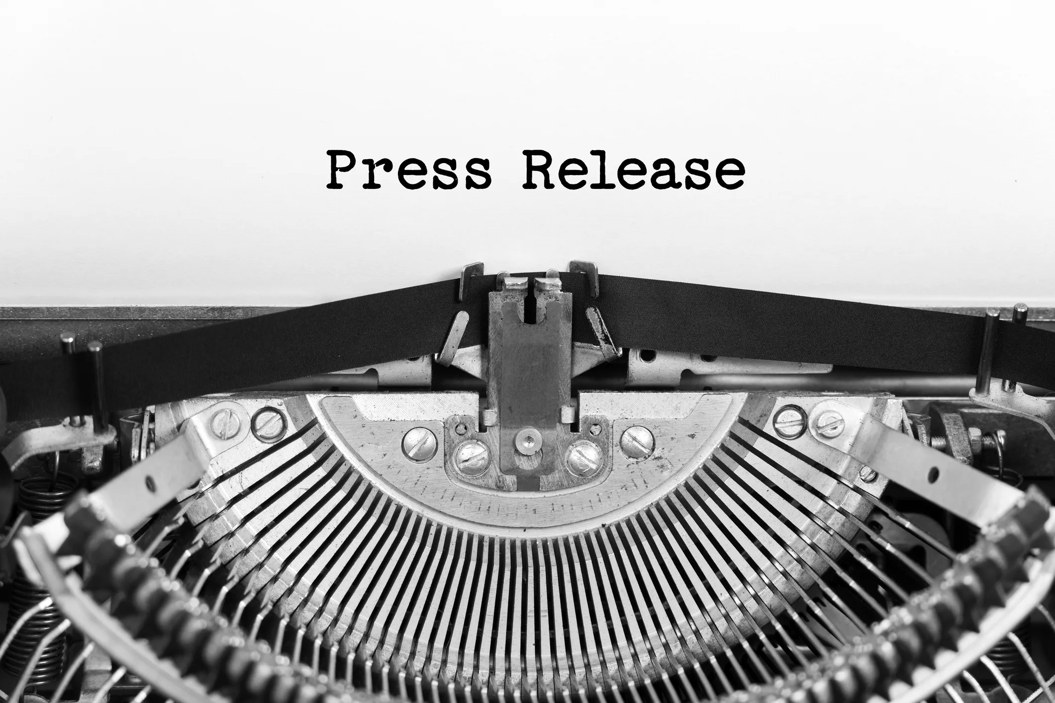 Close-up of a typewriter with the words "Press Release" typed on paper