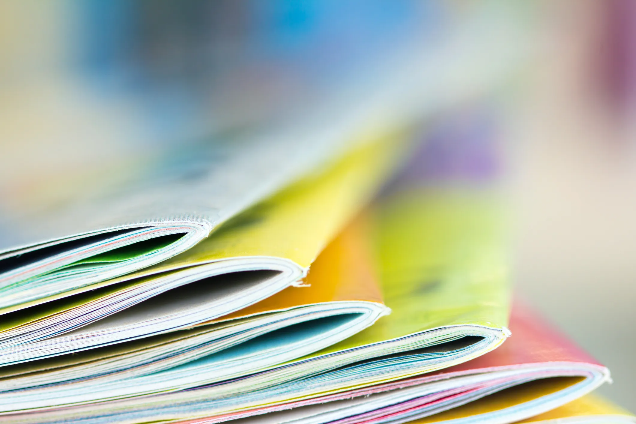 Stack of colourful publications fanned out